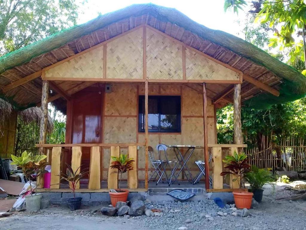 ألامينوس Traditional Filipino Transient House And Huts Near 100 Islands Wharf المظهر الخارجي الصورة